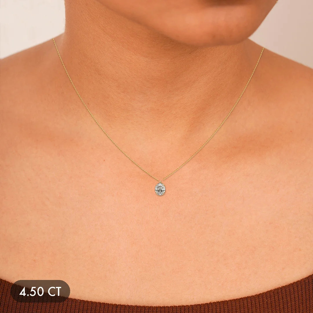 Gold chain necklace with a sparkling round diamond pendant.