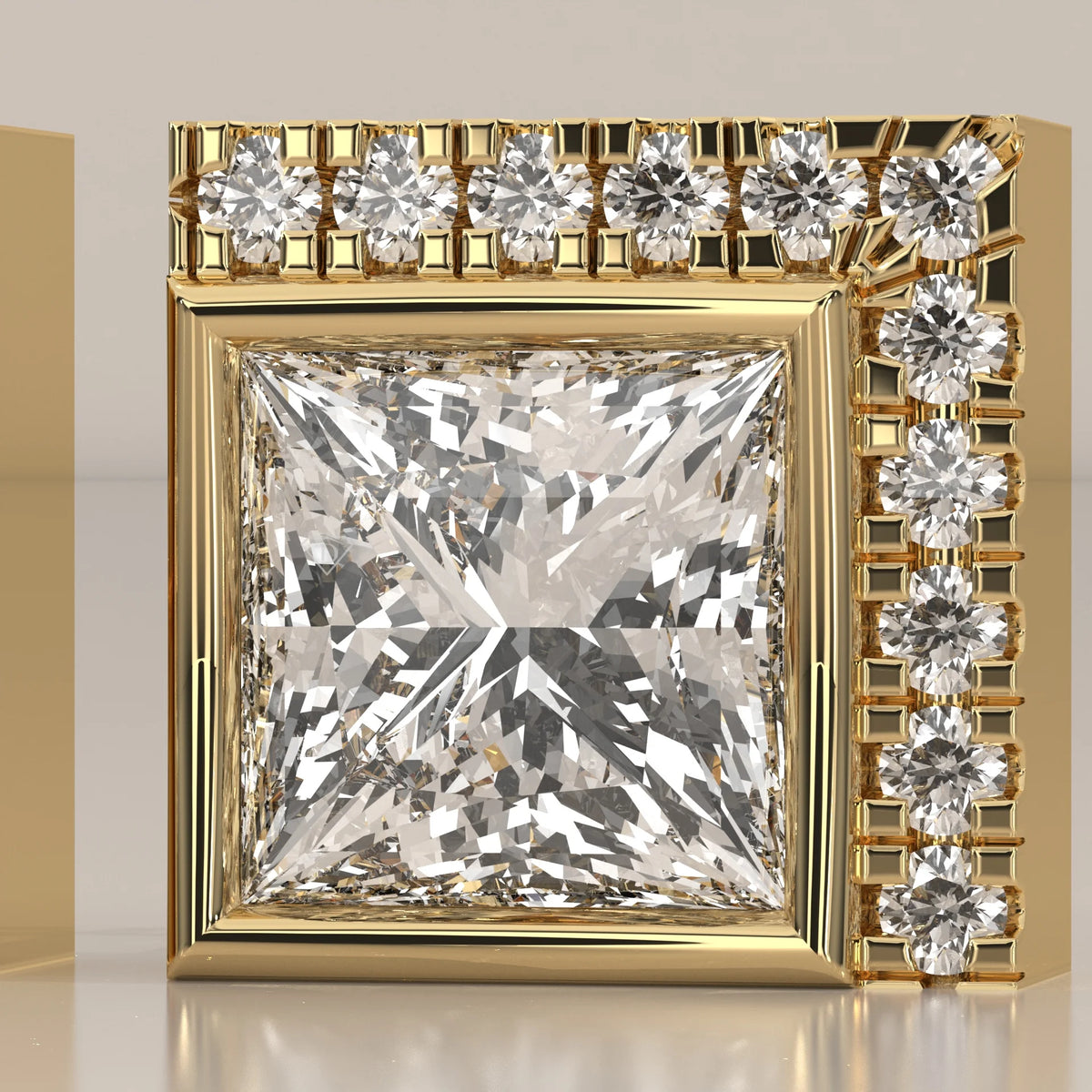Princess Cut Bezel Lab Grown Diamond Studs with L Shaped Pave Edge in yellow gold, front view on a plain background.