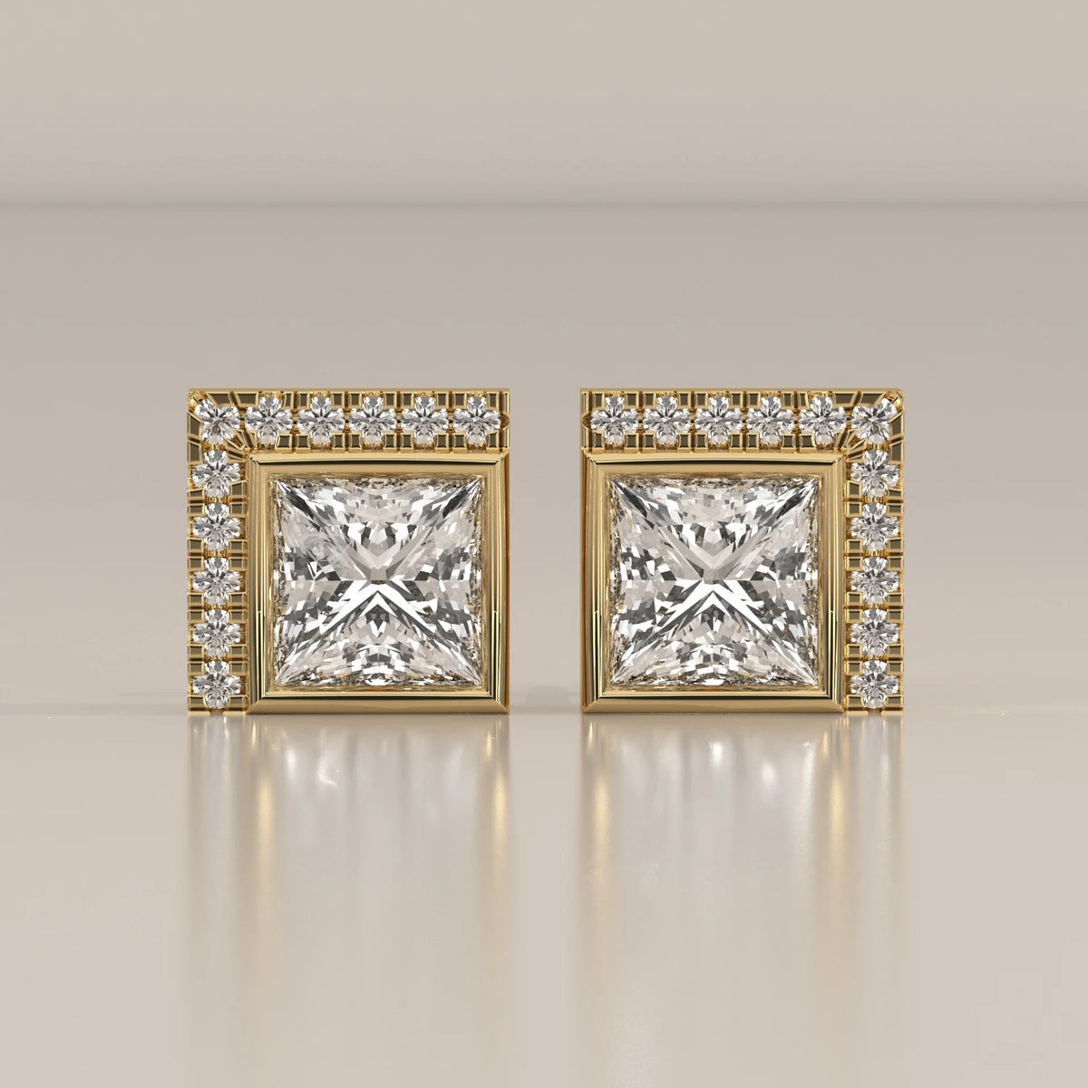 Princess Cut Bezel Lab Grown Diamond Studs with L Shaped Pave Edge in yellow gold, shown from the front.