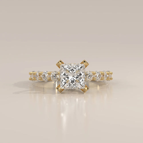 Princess Lab Grown Diamond Ring with Shared Claw Round Band in yellow gold, shown from the front.