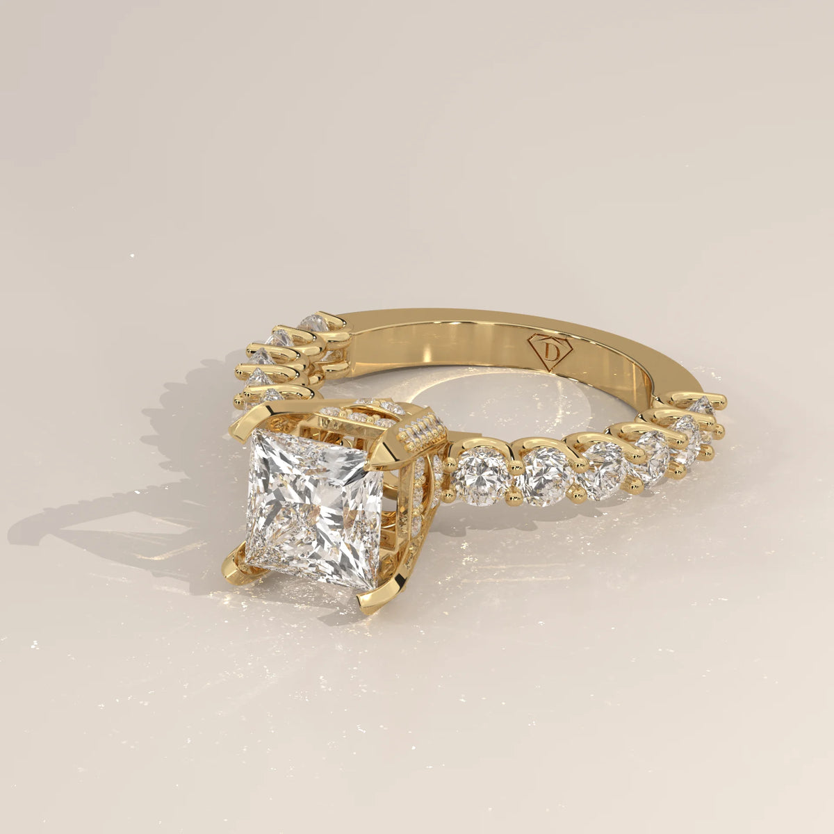 Princess Lab Grown Diamond Ring with Shared Claw Round Band in yellow gold, shown at an angle.