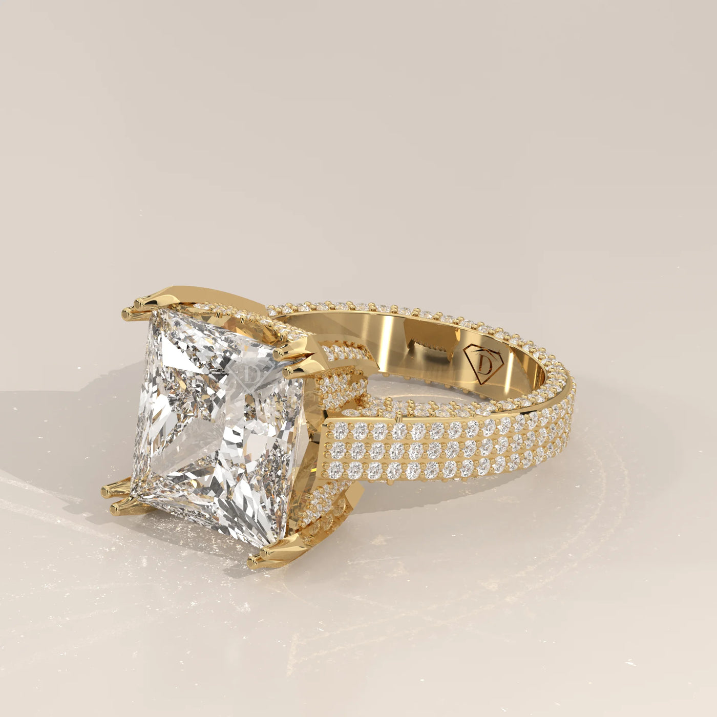 A dazzling princess-cut diamond ring set in yellow gold.
