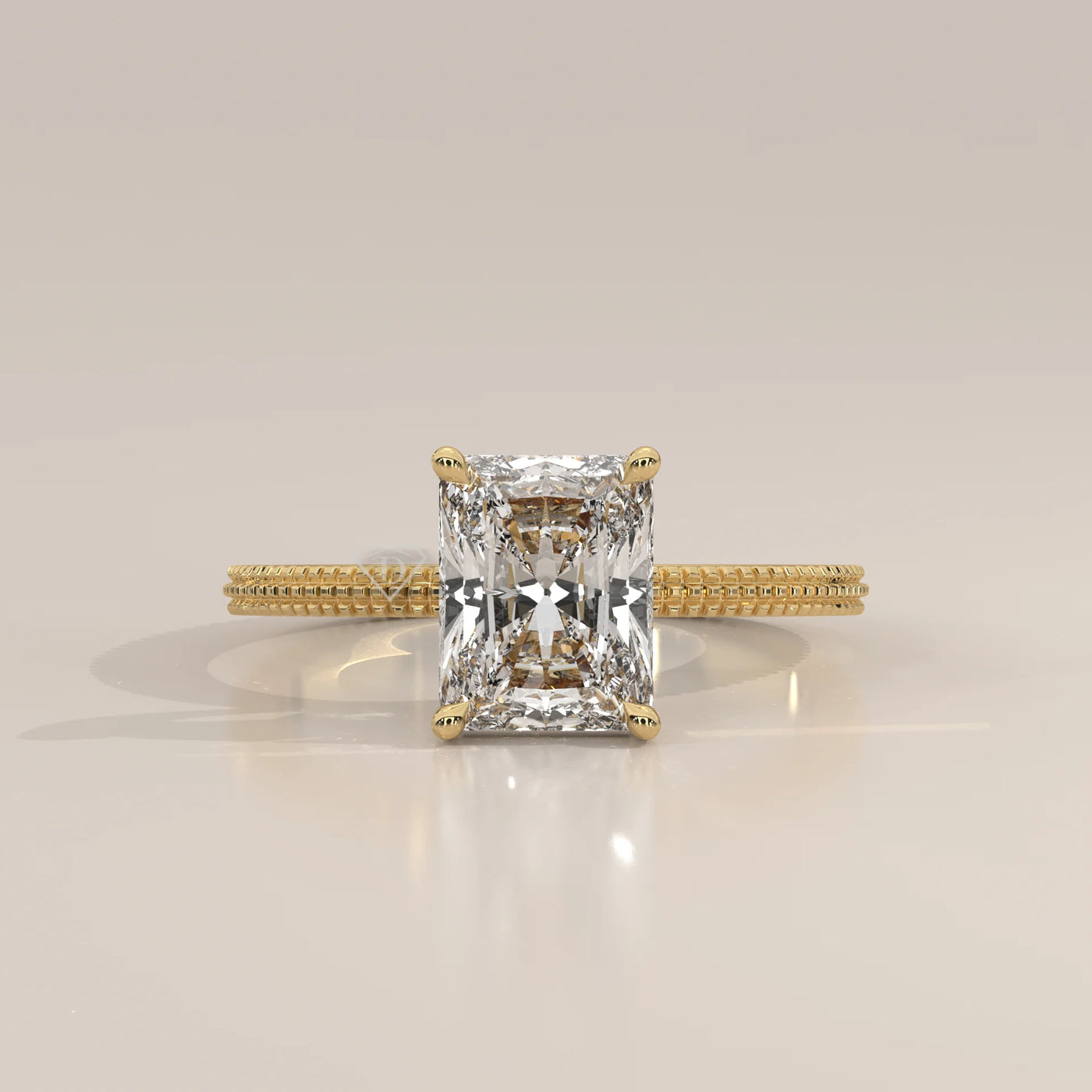 A radiant cut diamond engagement ring in yellow gold.