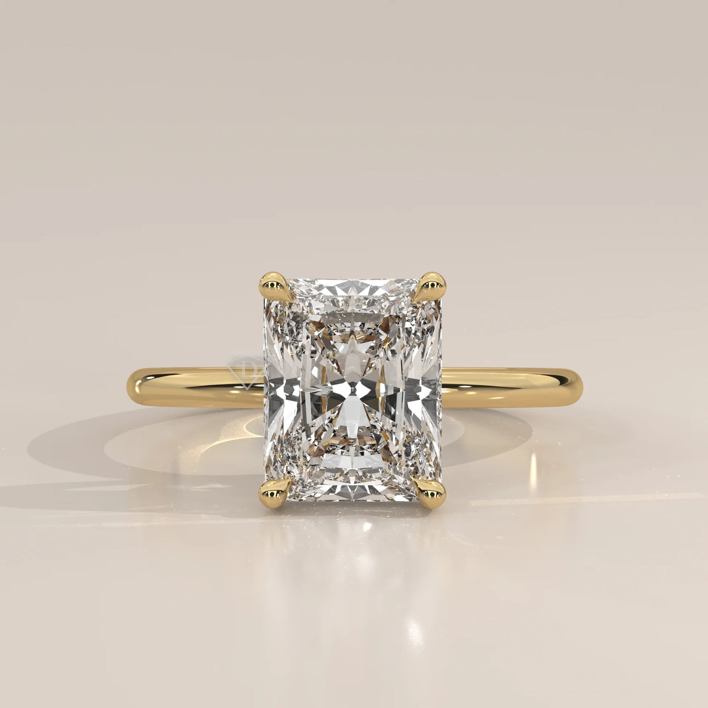 Classic 14k yellow gold ring with a radiant cut diamond.