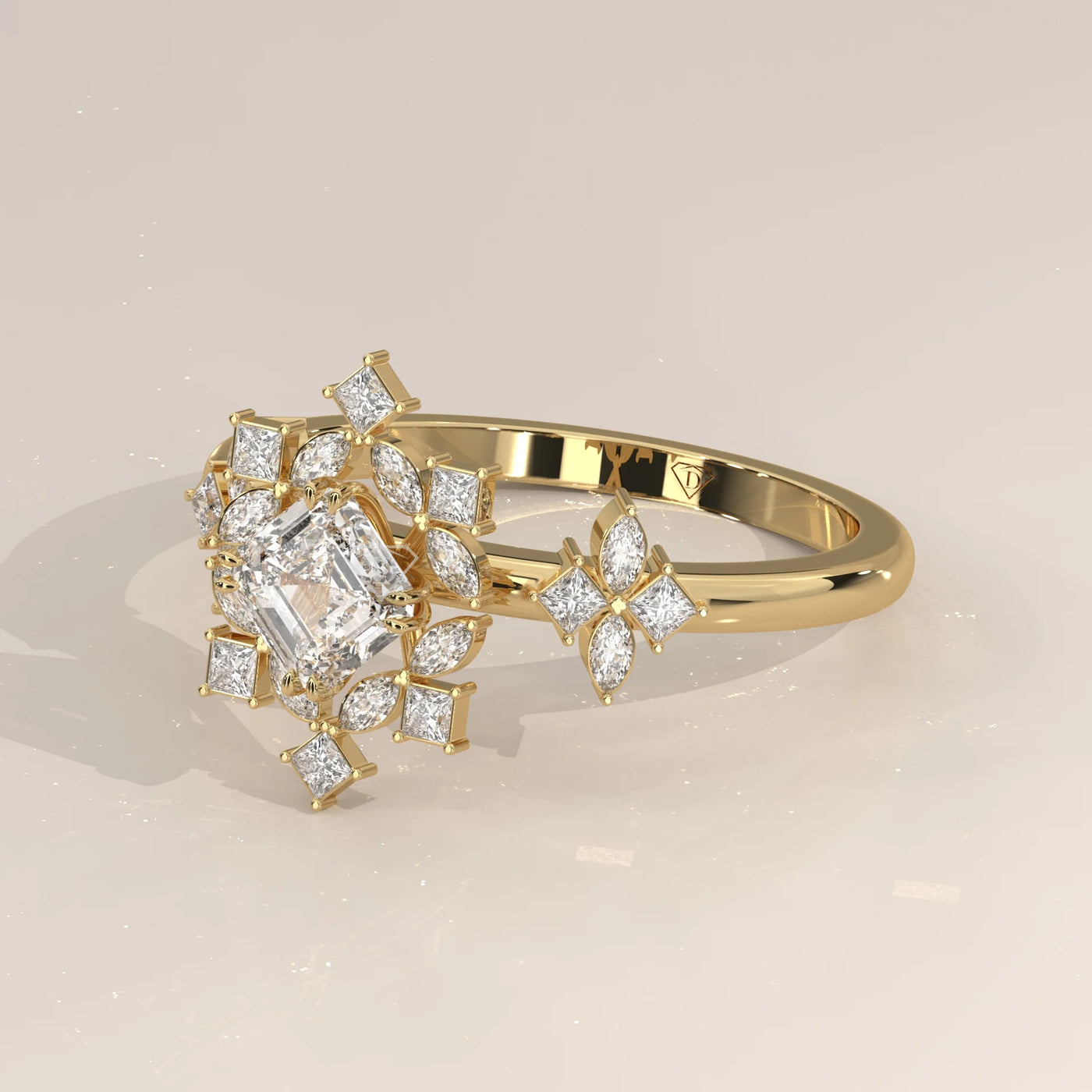 Gold ring with a central asscher cut diamond and smaller diamond accents.