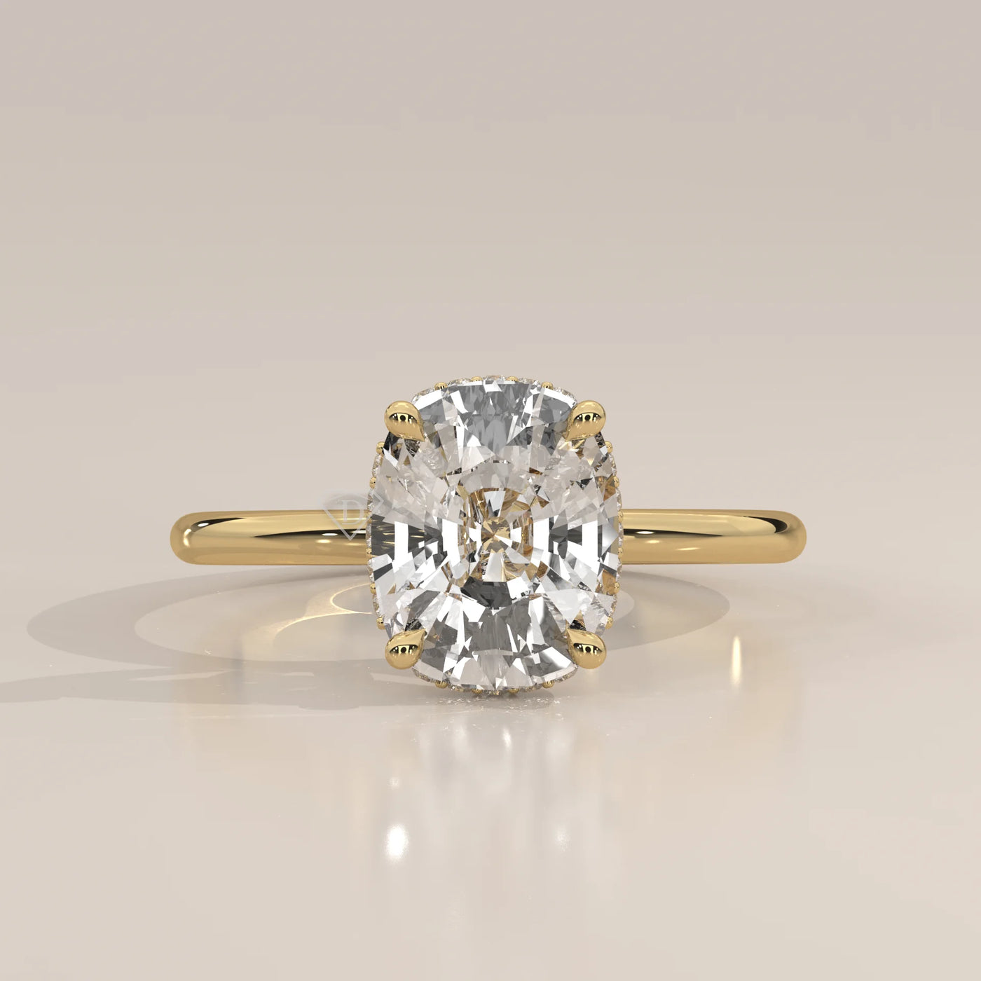 A cushion-cut diamond engagement ring in 14k yellow gold with pavé band.