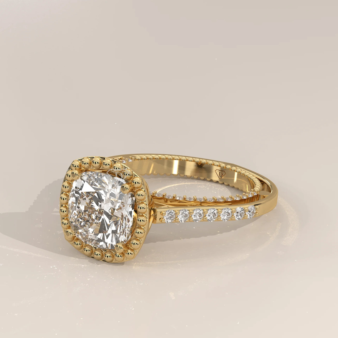 A classic 14k yellow gold engagement ring with a cushion cut diamond and side stones.