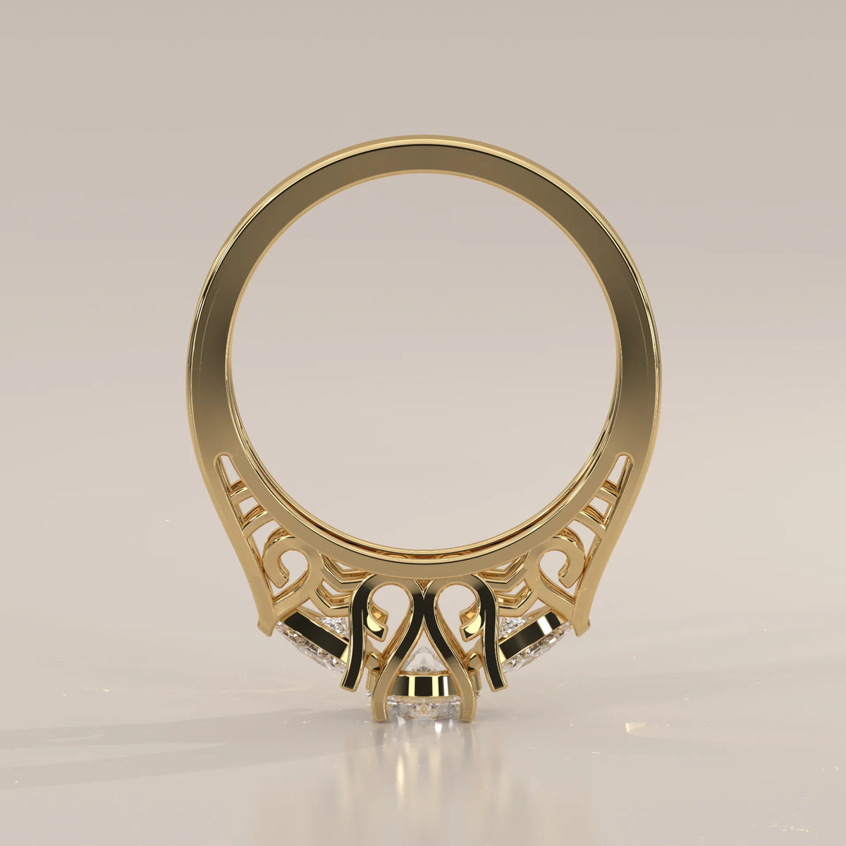 Round and Trillion Lab Grown Diamond Three Stone Filigree Ring in yellow gold, product photograph on a plain background.