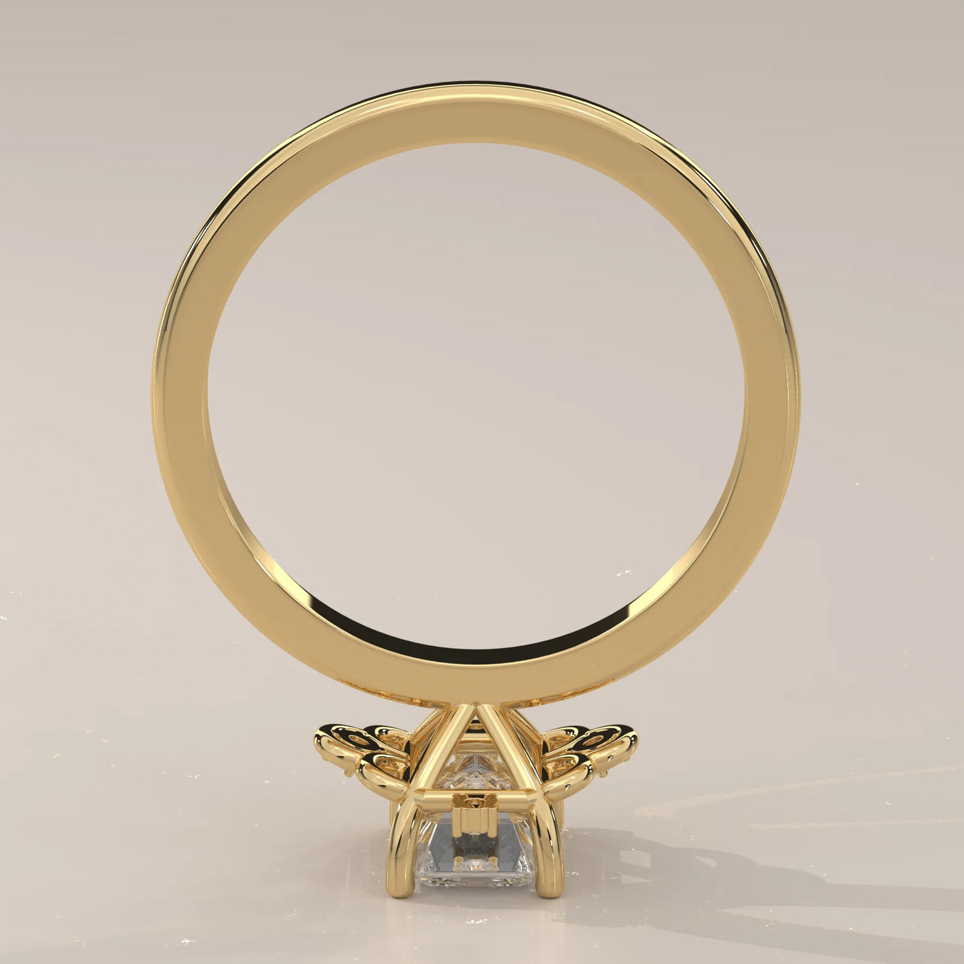 A 14k yellow gold ring with an emerald-cut diamond and intricate detailing.