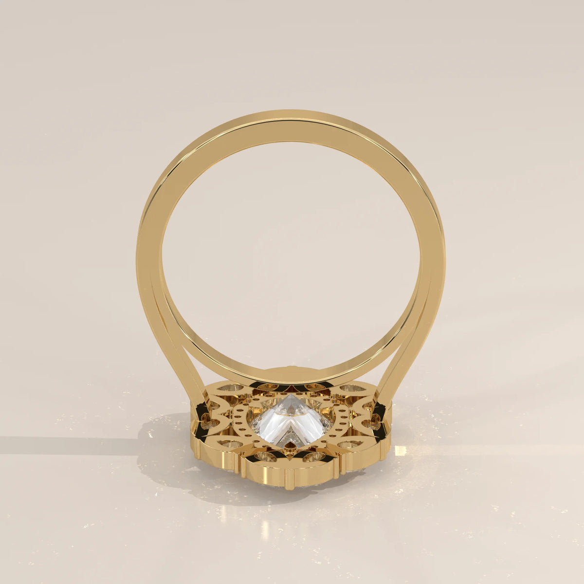 Gold ring with a clear gemstone and intricate detailing on the band.