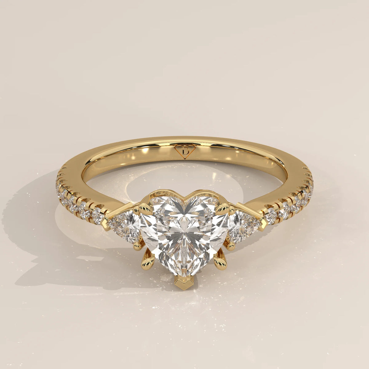 Heart Lab Grown Diamond Three Stone Ring with Trillion Sides in yellow gold, shown from the front.