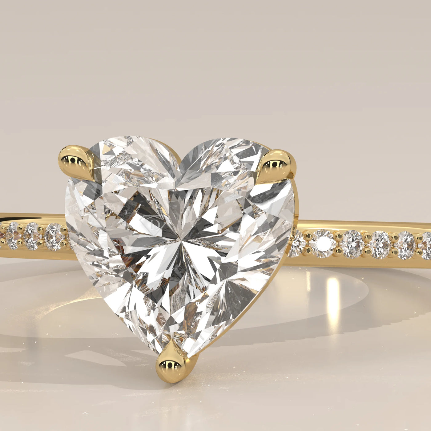 Close-up of a heart-shaped diamond engagement ring in gold.