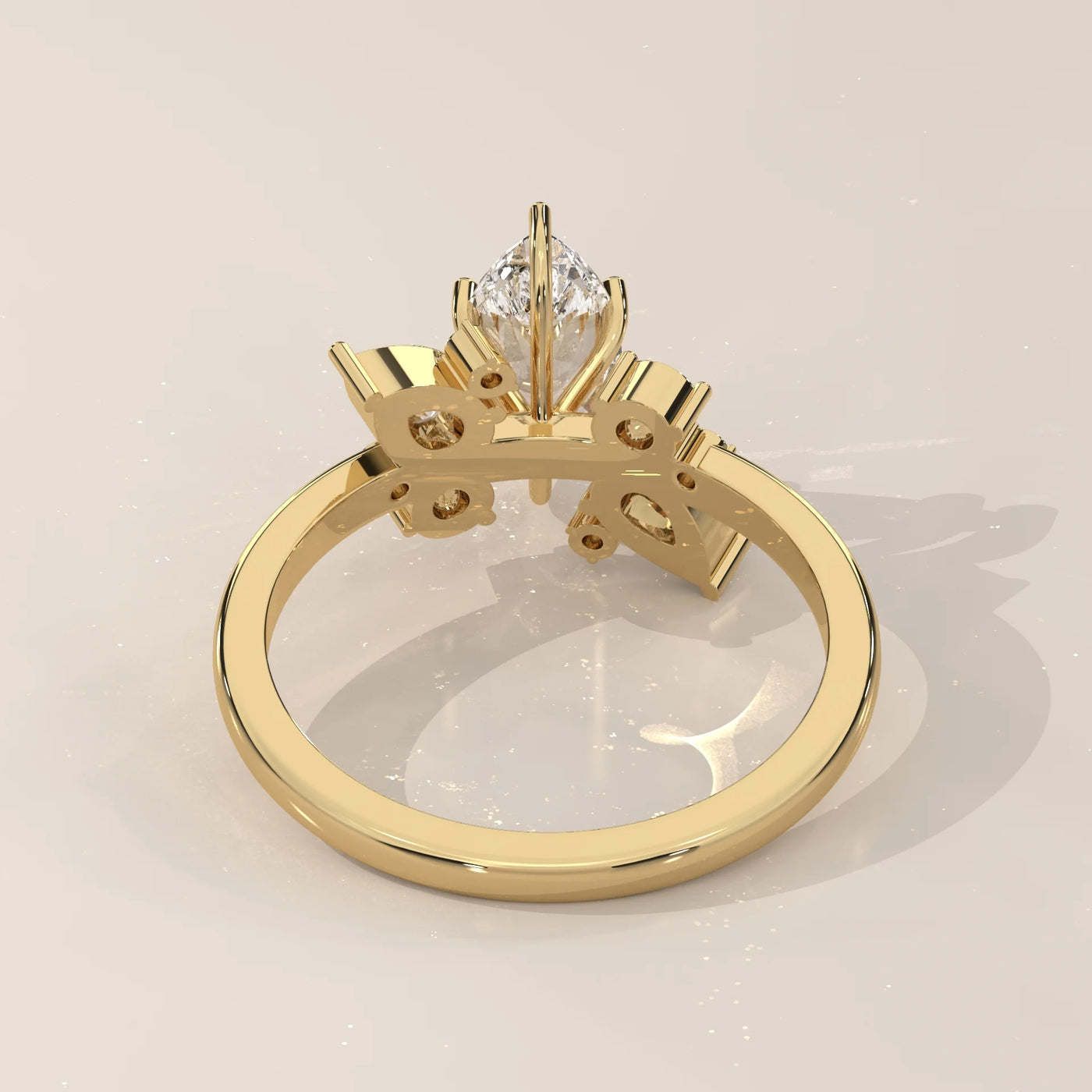 Gold ring with a marquise-cut diamond and side stones.