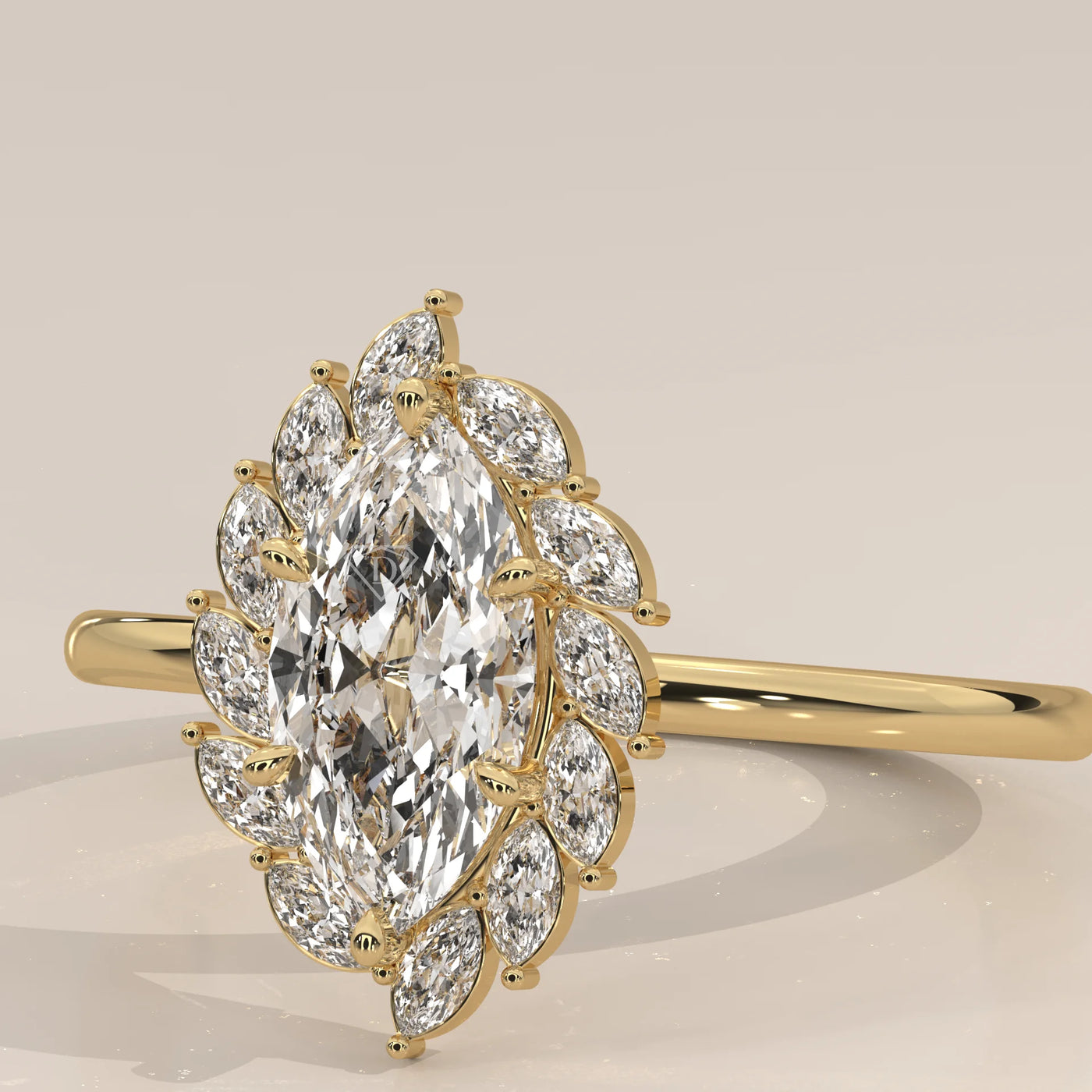 A yellow gold ring featuring a marquise cut diamond surrounded by smaller diamonds.