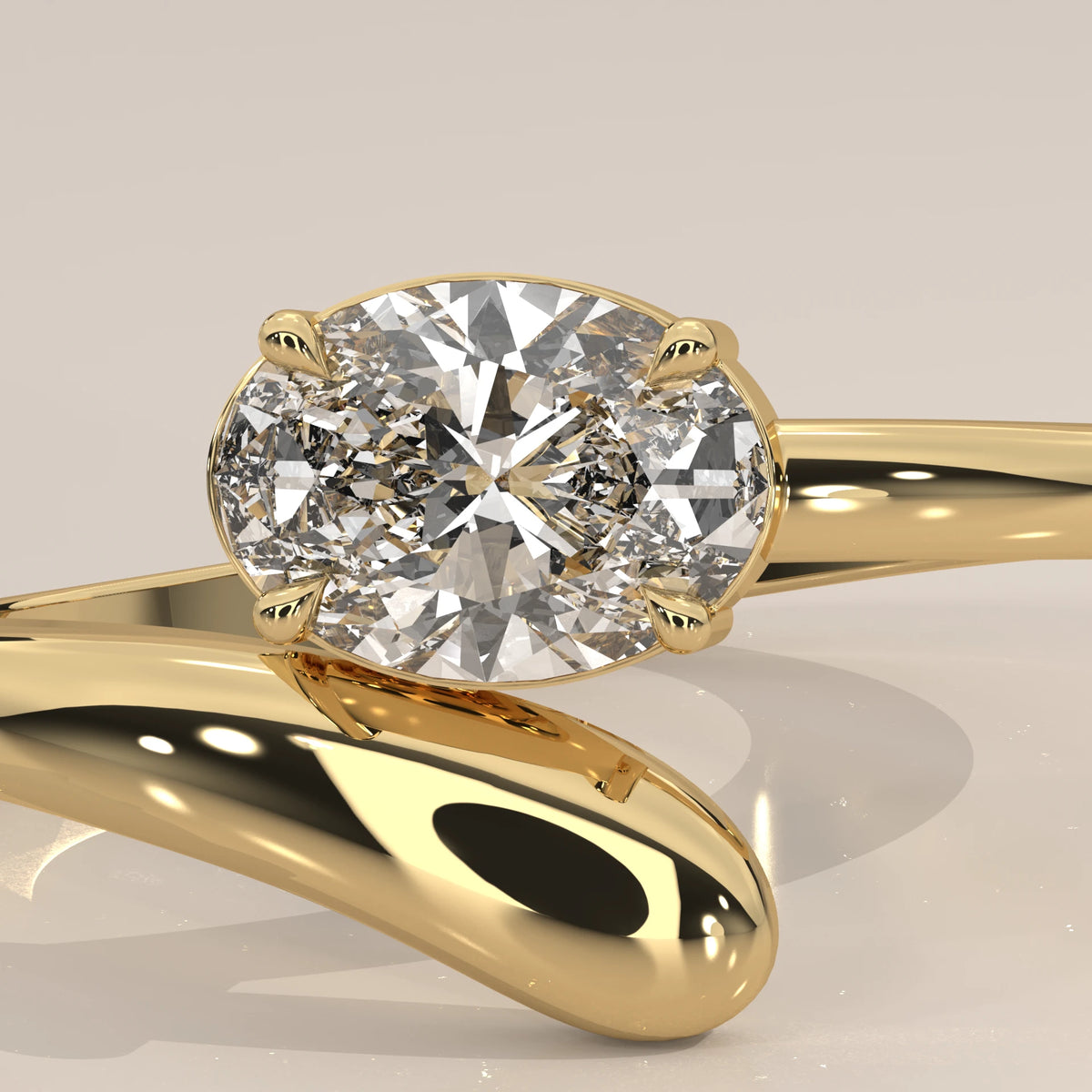East West Oval Lab Grown Diamond Bypass Ring with Teardrop End in yellow gold, shown in close-up.