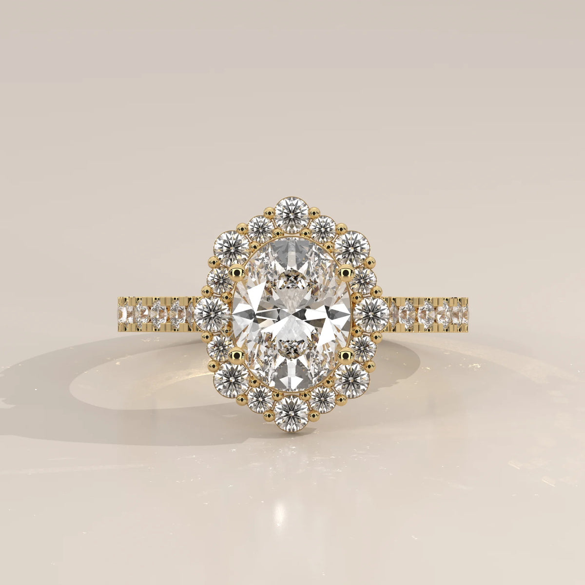 Oval Lab Grown Diamond Cluster Halo Ring with Pave Band in yellow gold, photographed head-on.