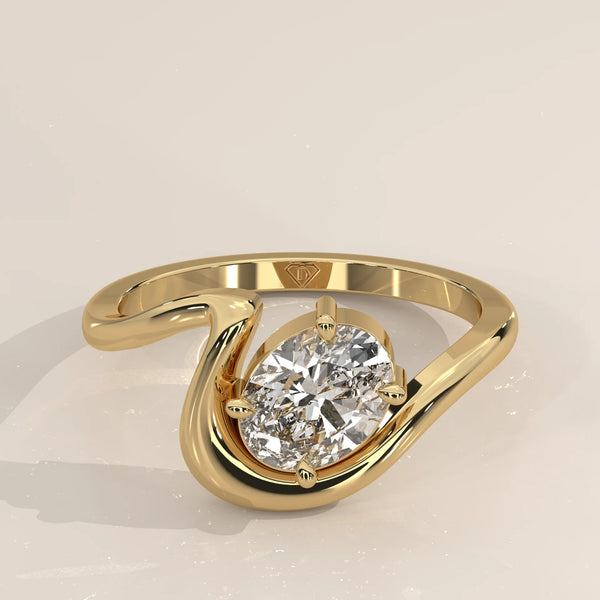 A yellow gold ring with a prominent oval-cut diamond.