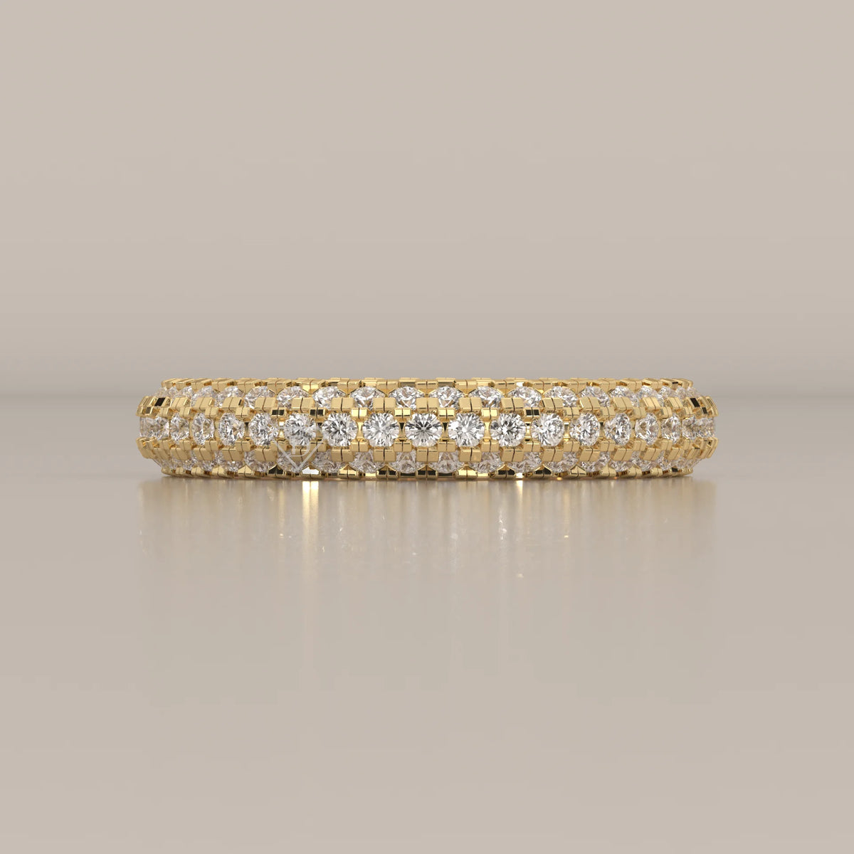 Domed yellow gold band with three full rows of pave round lab grown diamonds, photographed head-on.