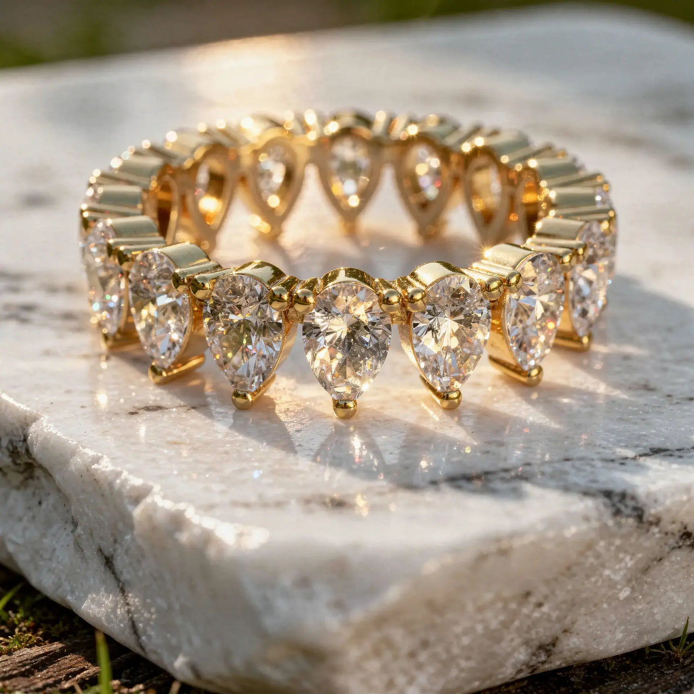 Close-up: Pear Cut Diamond Ring with Channel Setting in 14k Yellow Gold - Lab Grown - Driona Jewels