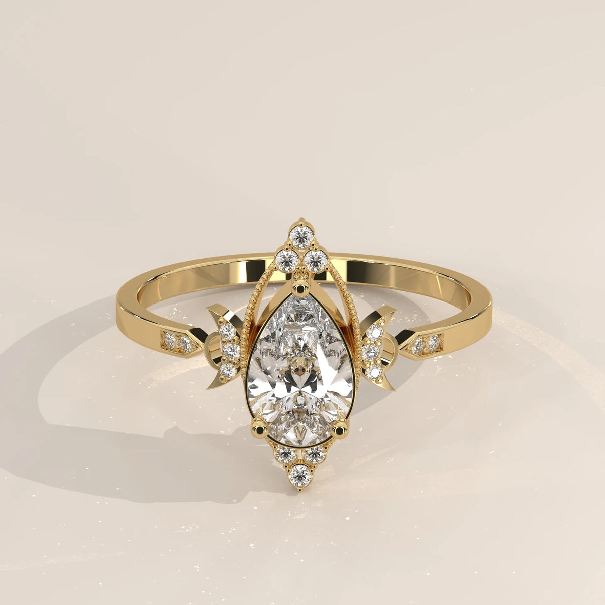 A delicate gold ring featuring a prominent pear-shaped diamond surrounded by smaller accent stones.