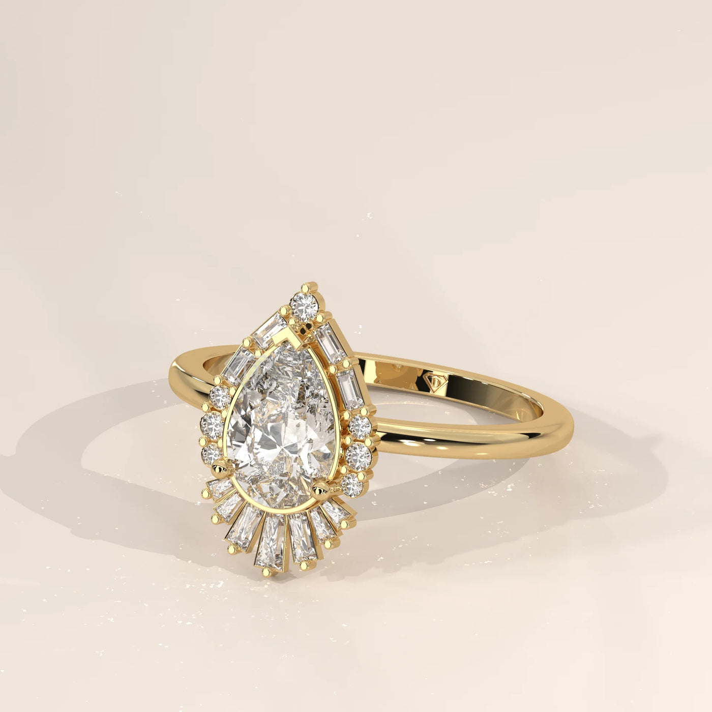 A delicate 14k gold ring with a pear-shaped diamond, shown from the side.