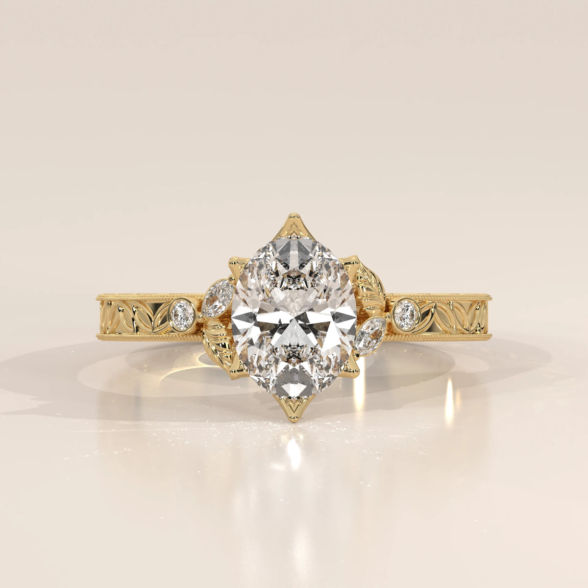 Pear shaped diamond engagement ring in yellow gold with intricate detailing.