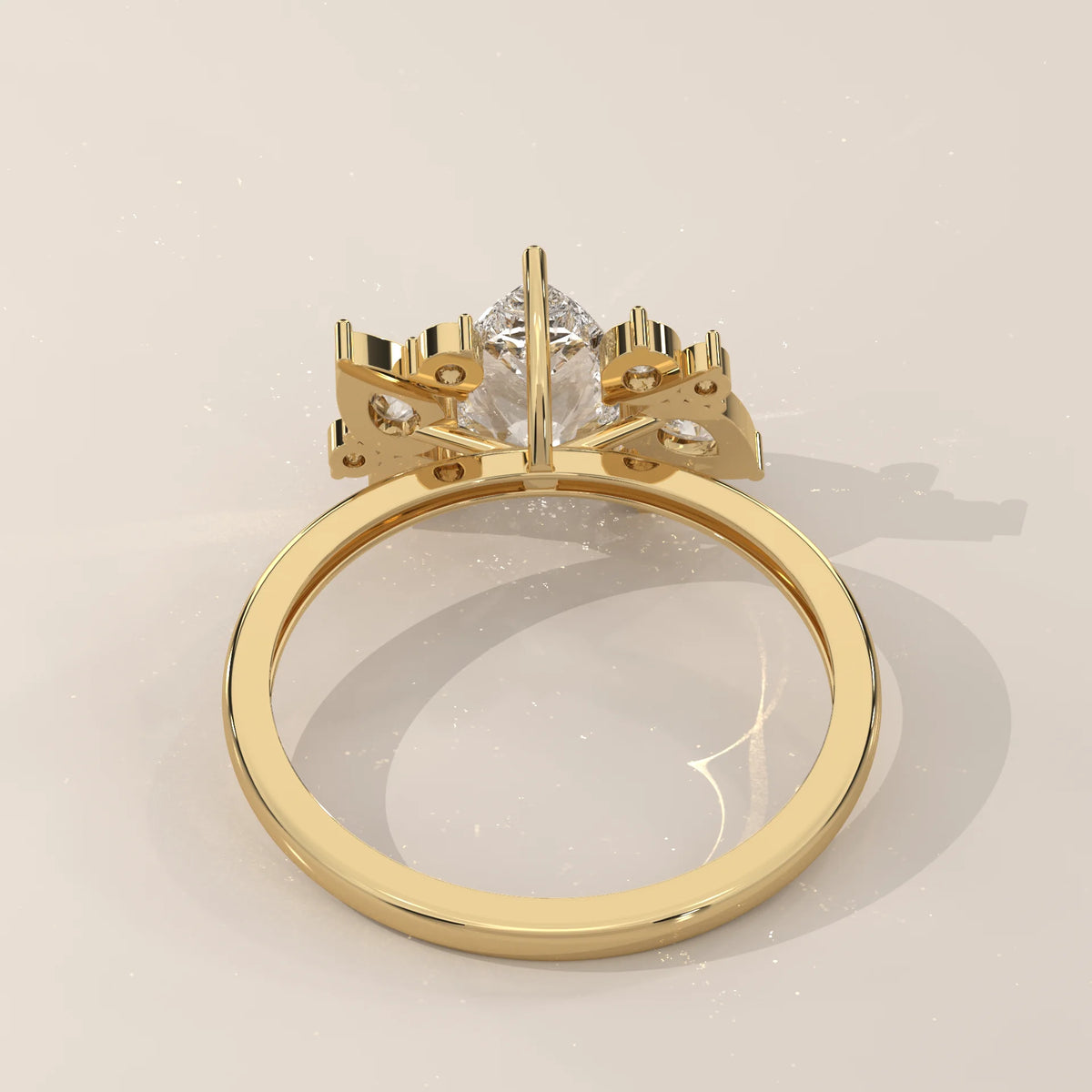 Pear Lab Grown Diamond Ring with Scattered Pear and Round Cluster in yellow gold, photographed at a three-quarter angle.