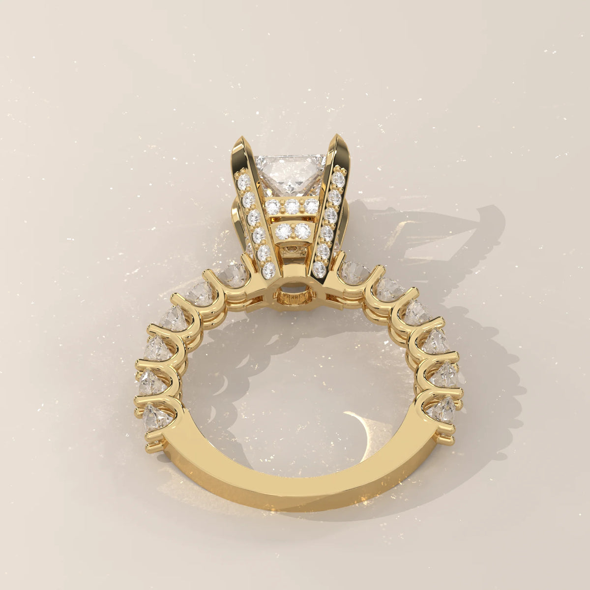 Princess Lab Grown Diamond Ring with Shared Claw Round Band in yellow gold, shown from the side.