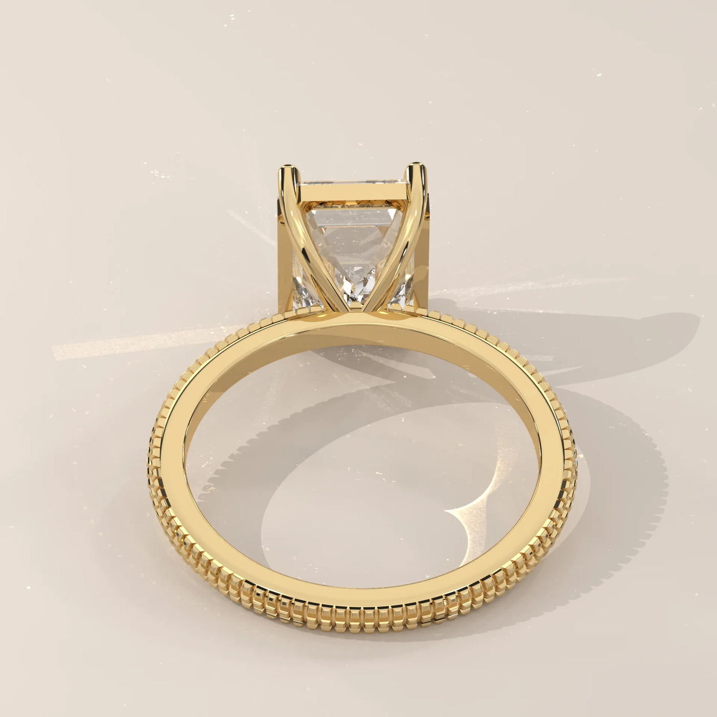 A yellow gold ring with a princess-cut diamond, viewed from the back.