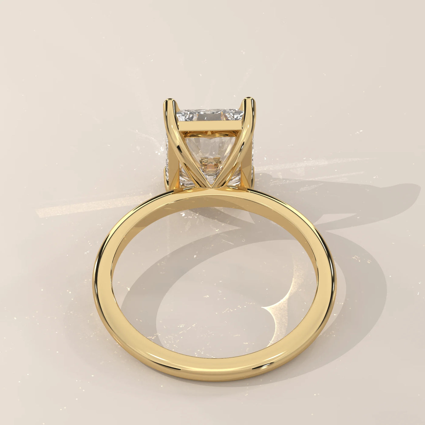 Yellow gold ring with a princess-cut diamond.