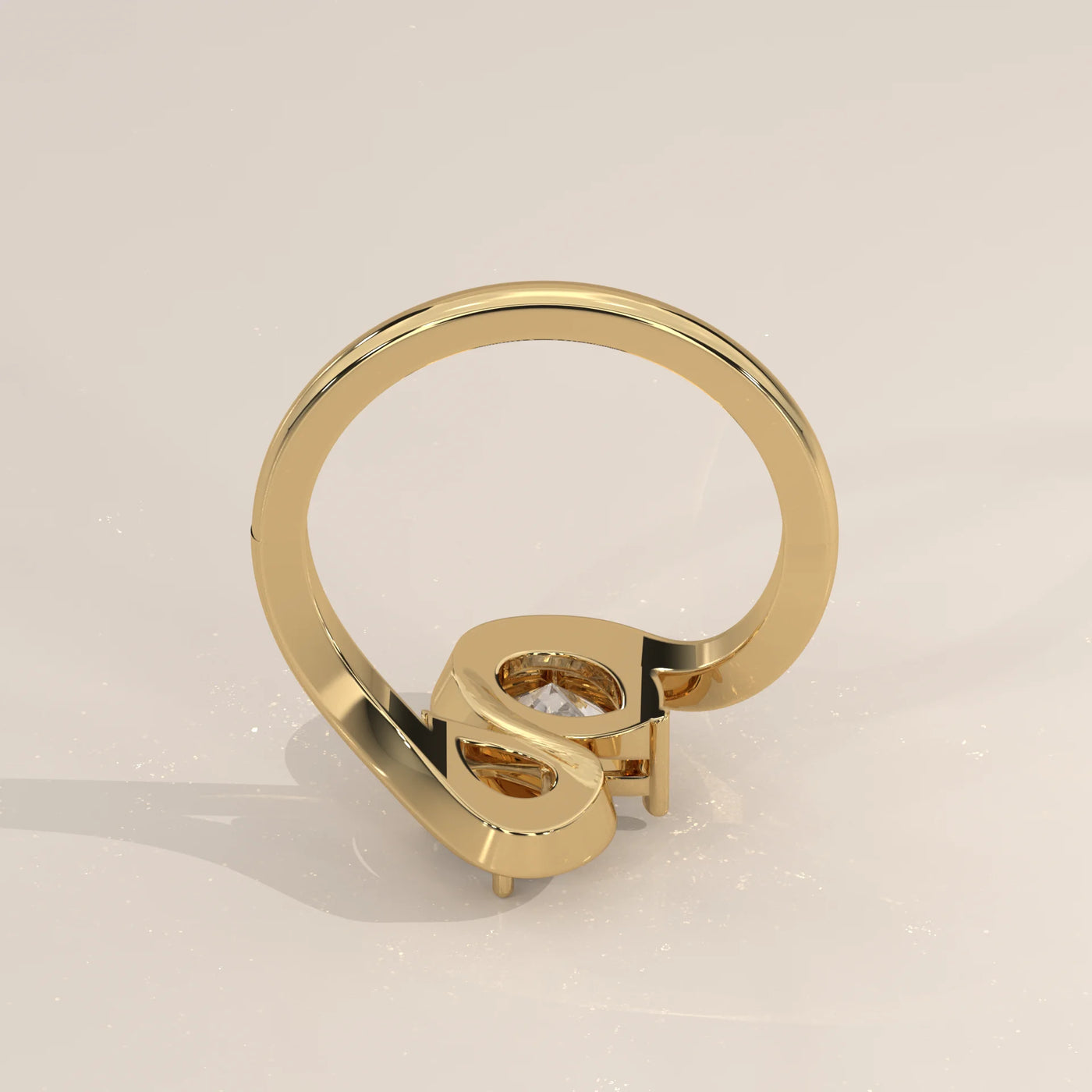 A gold ring with a round diamond set in a unique bypass design.