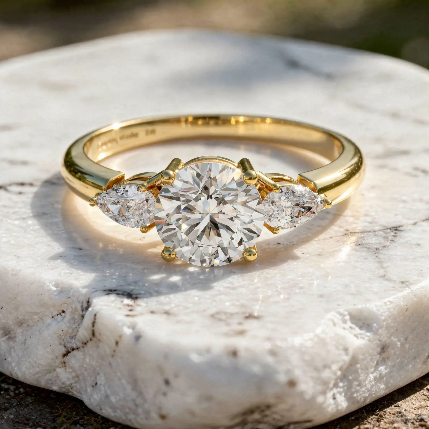 Flat Lay: Round Diamond Ring with Three Stone Setting in 14k Yellow Gold - Lab Grown - Driona Jewels