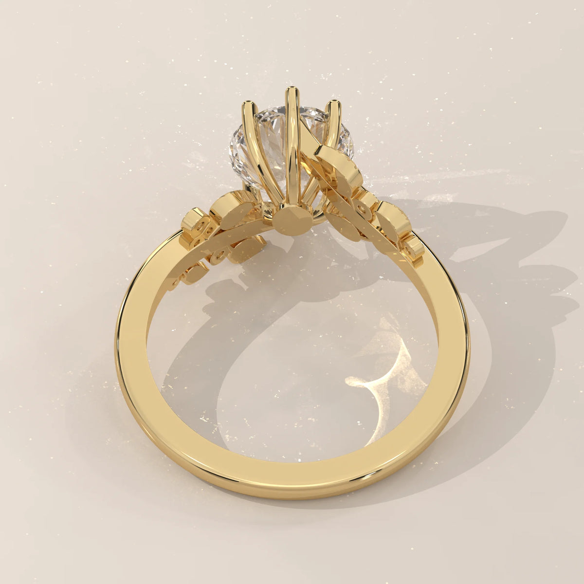 A yellow gold ring with a round diamond and leaf accents.