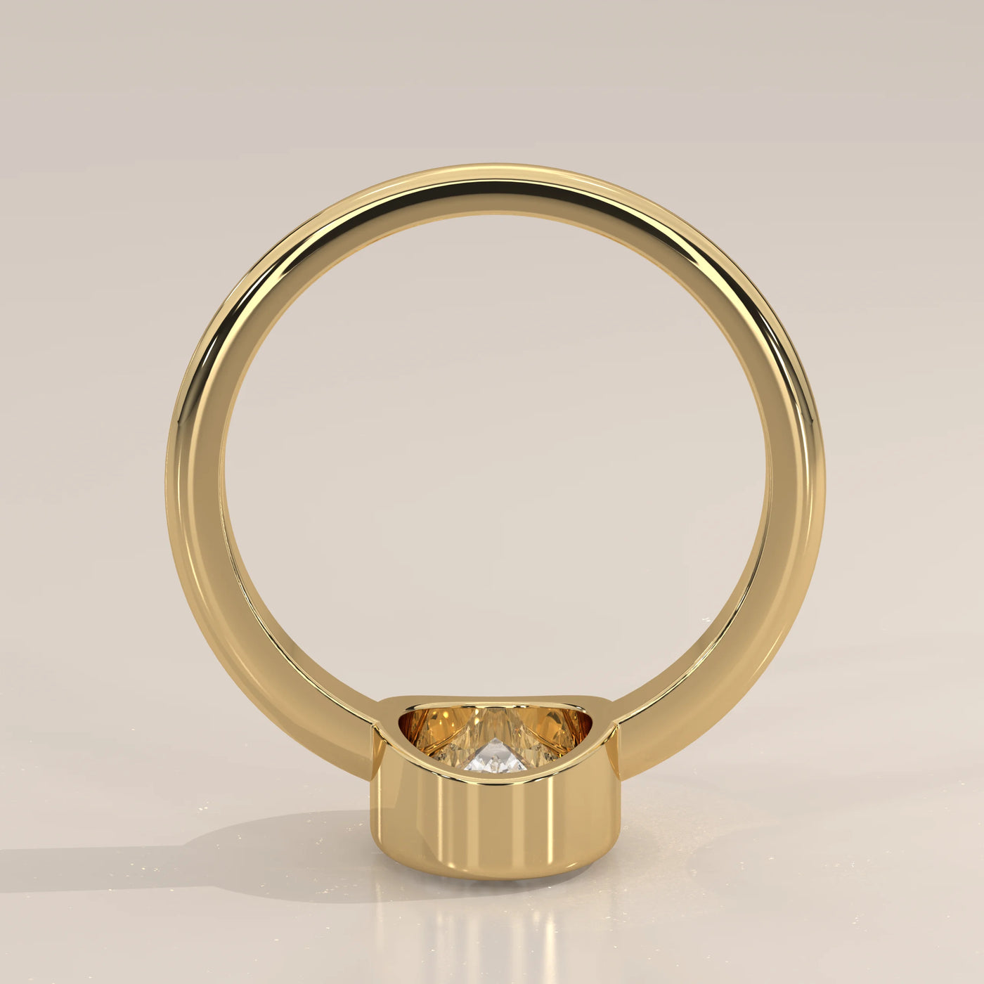 A simple 14k gold ring with a single diamond visible from the back.