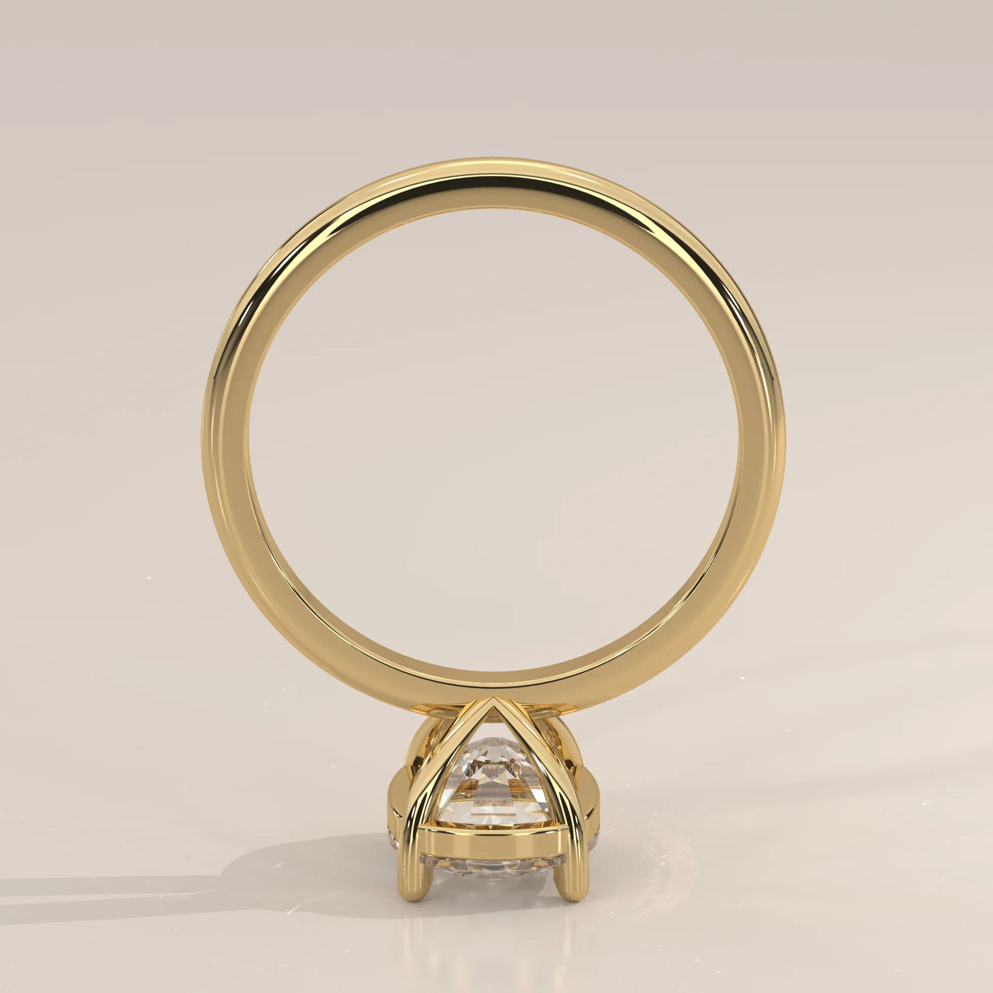 A classic 14k yellow gold ring with a large diamond and pave band.