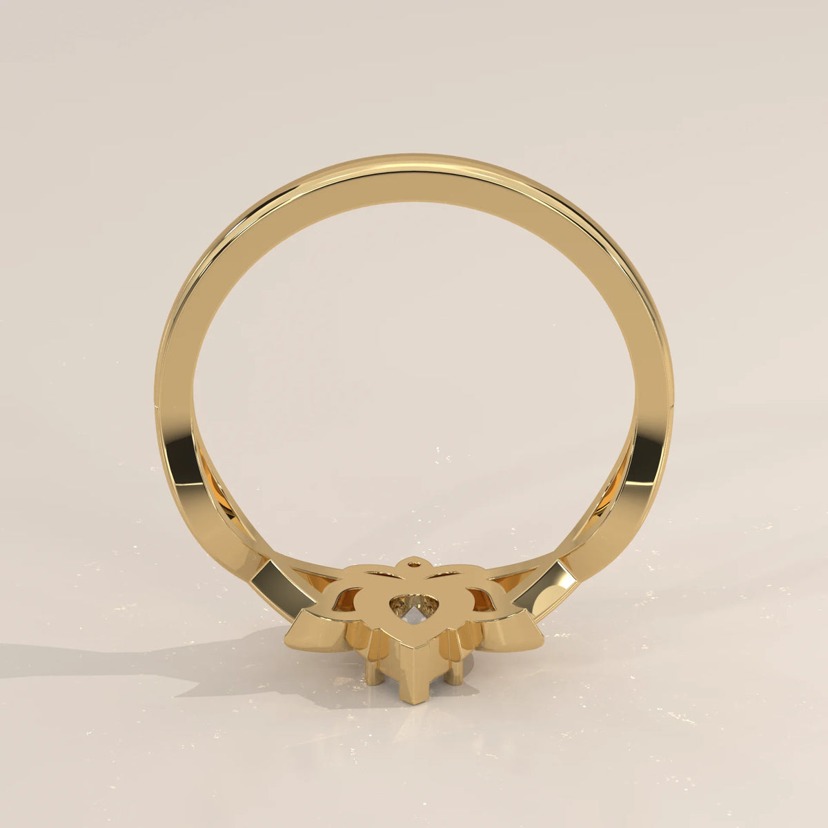 A yellow gold ring with a solitaire diamond set in an ornate, star-like setting.