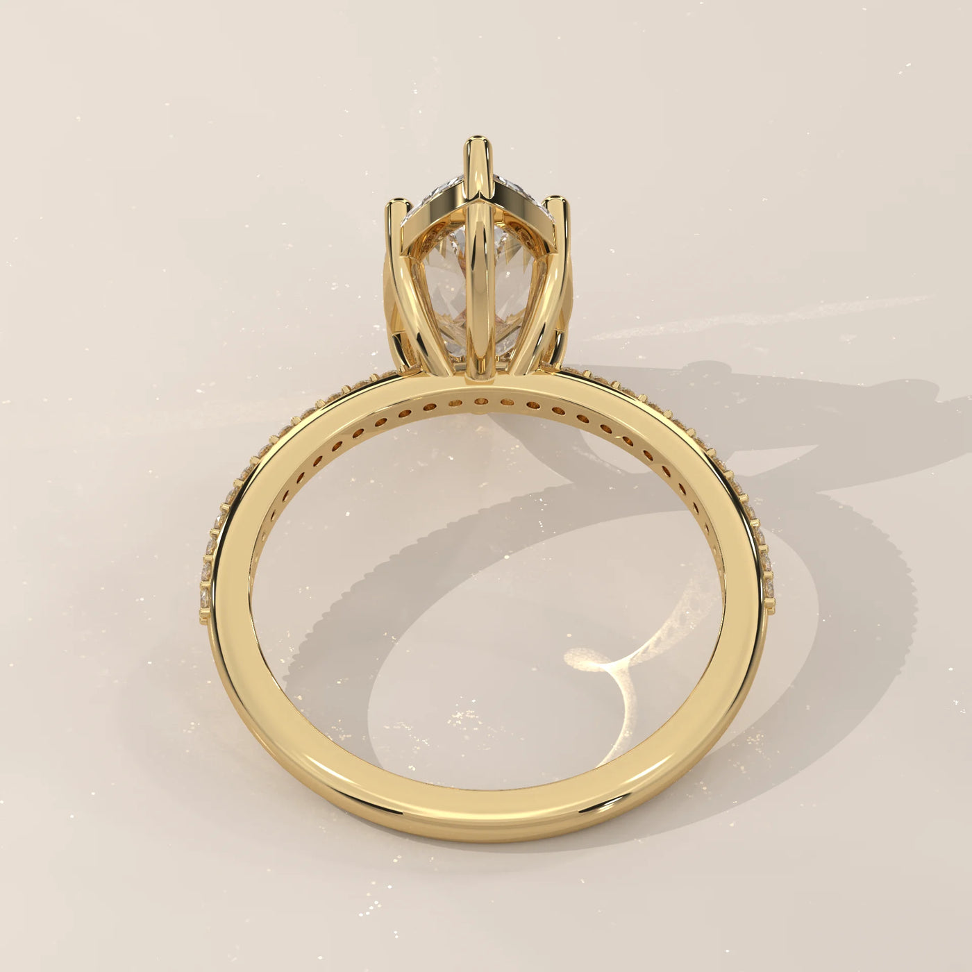 A yellow gold ring with a large diamond and small stones along the band.