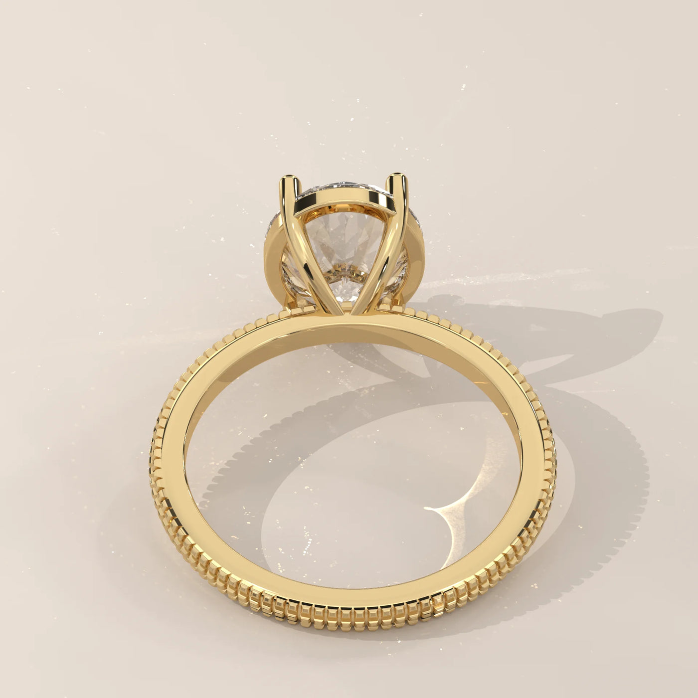 A classic solitaire diamond ring in 14k yellow gold with pavé band details.