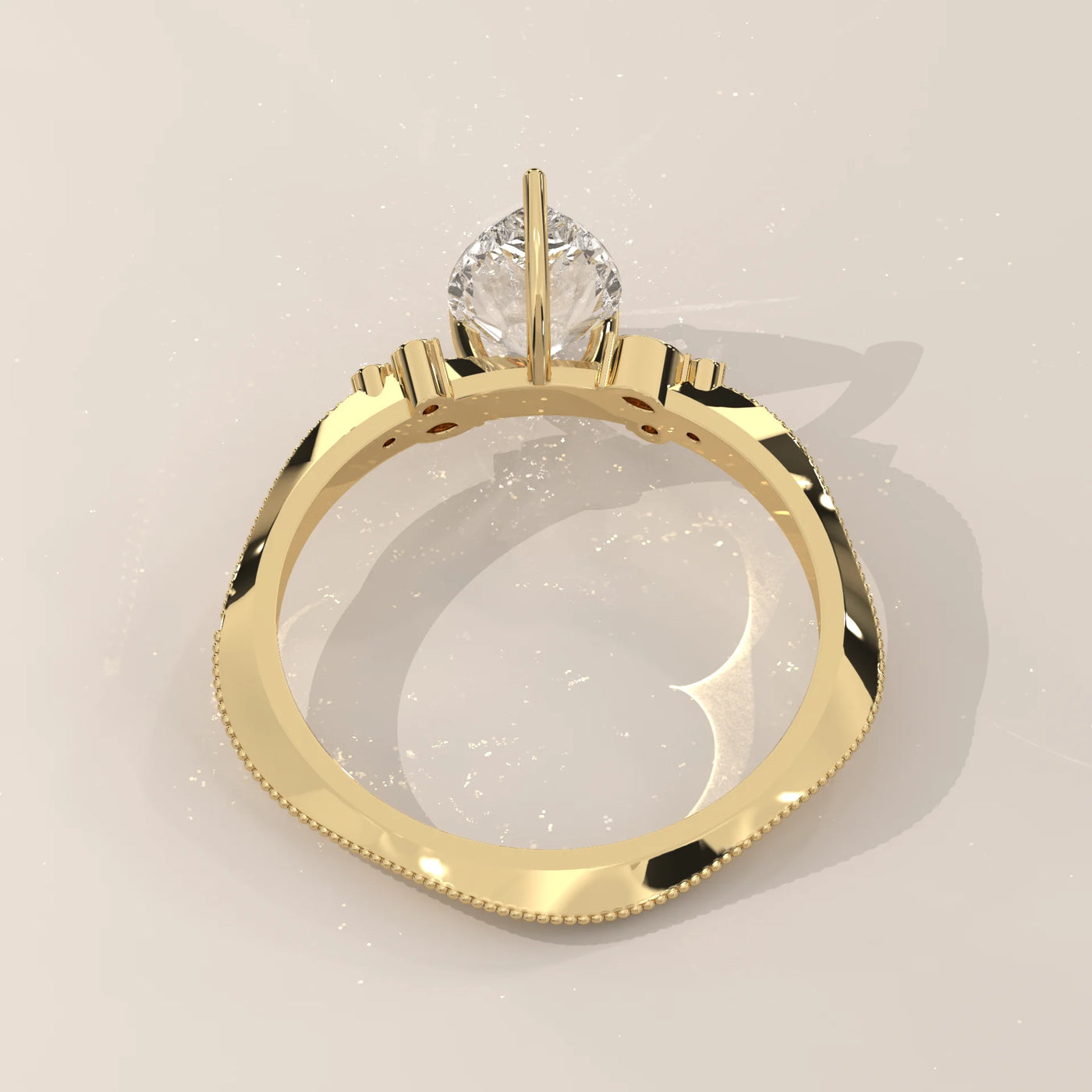 A close-up, top-down view of a yellow gold ring with a solitaire diamond.