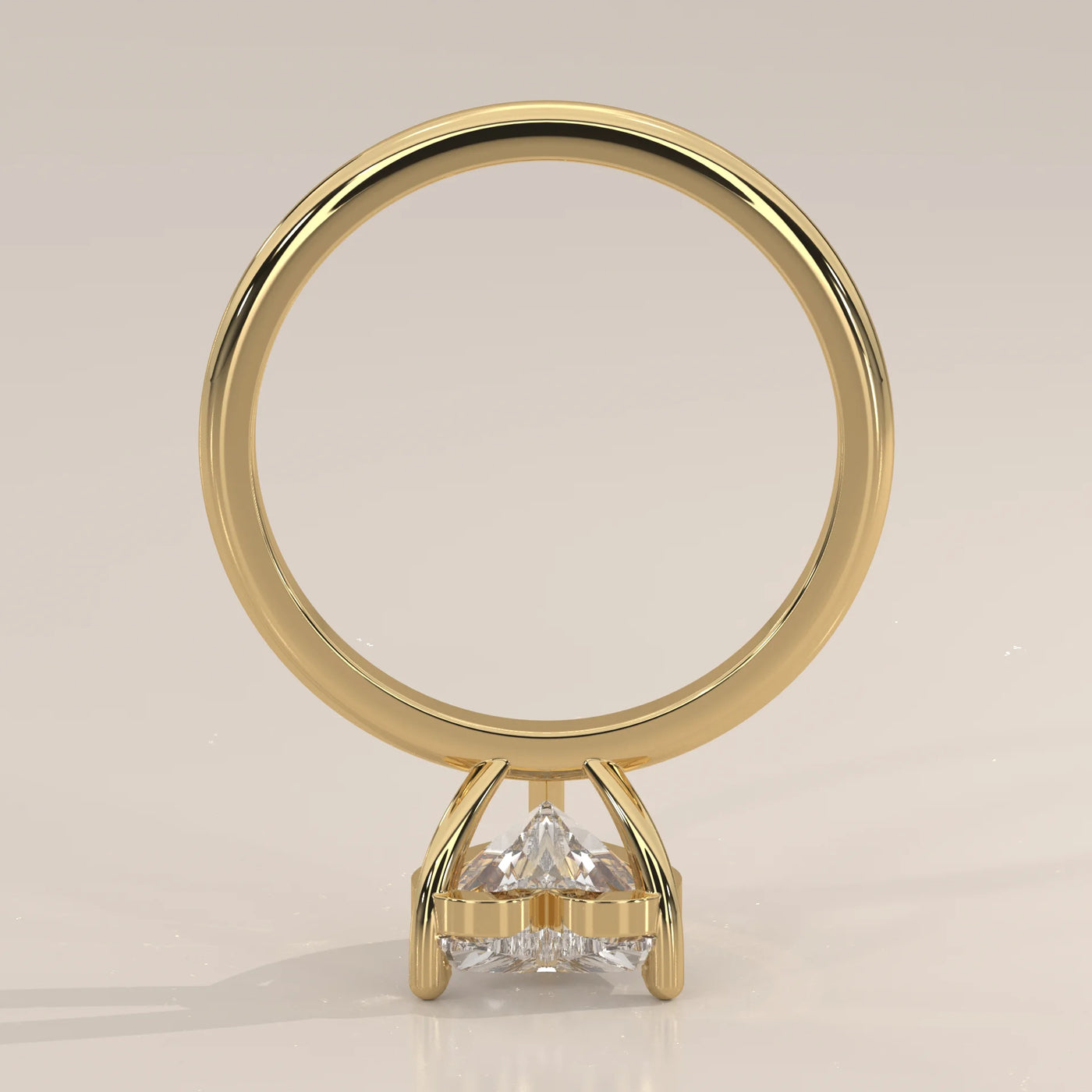 Yellow gold ring with a triangle-cut diamond.