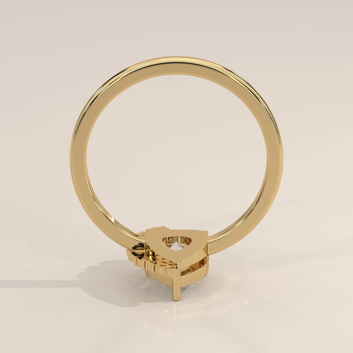 A 14k yellow gold ring with a trillion-cut diamond.