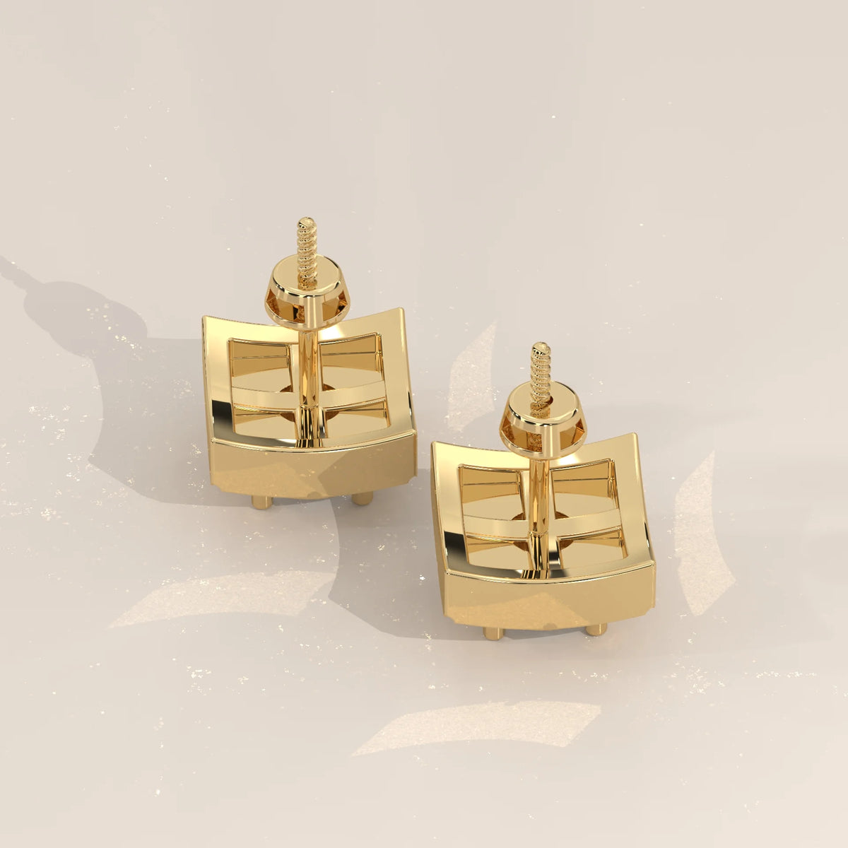 Round Lab Grown Diamond Studs on a Diamond Shaped Gold Plate in yellow gold, studio photograph on a plain background.