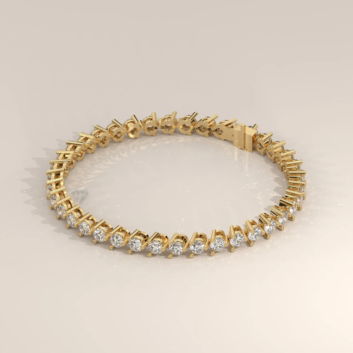 Round Lab Grown Diamond Tennis Bracelet in Three Prong Settings in yellow gold, shown on a plain background.