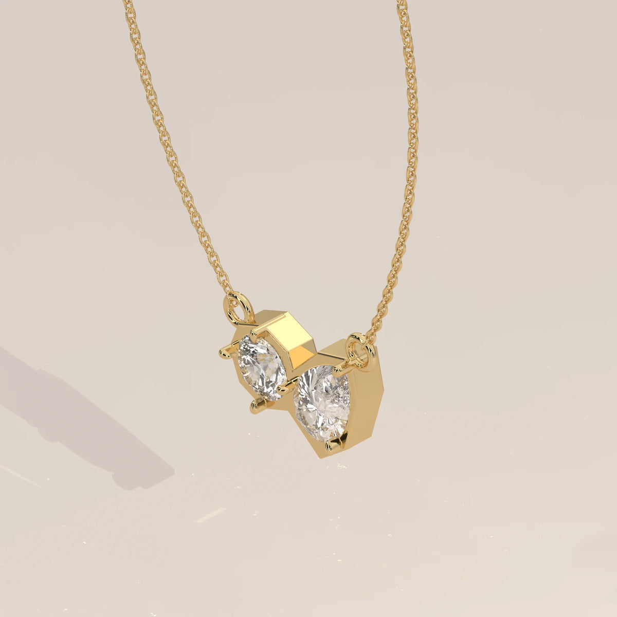 Round and Pear Lab Grown Diamond Geometric Frame Bar Pendant in yellow gold, photographed head-on.