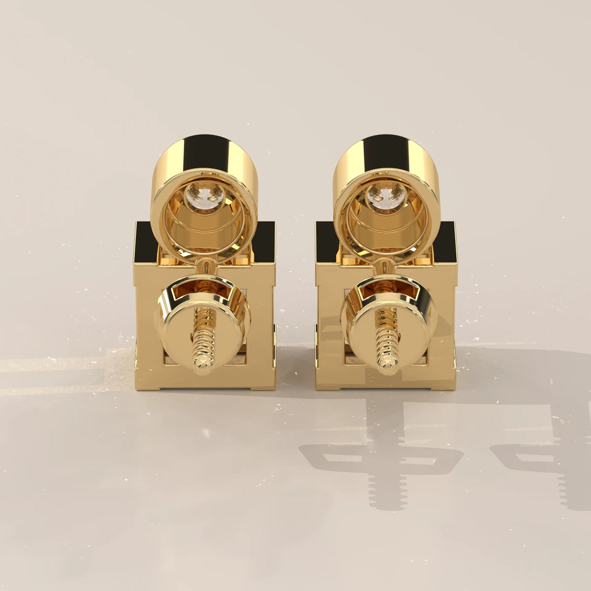Round and Princess Two Stone Lab Grown Diamond Stud Earrings in yellow gold, photographed head-on.