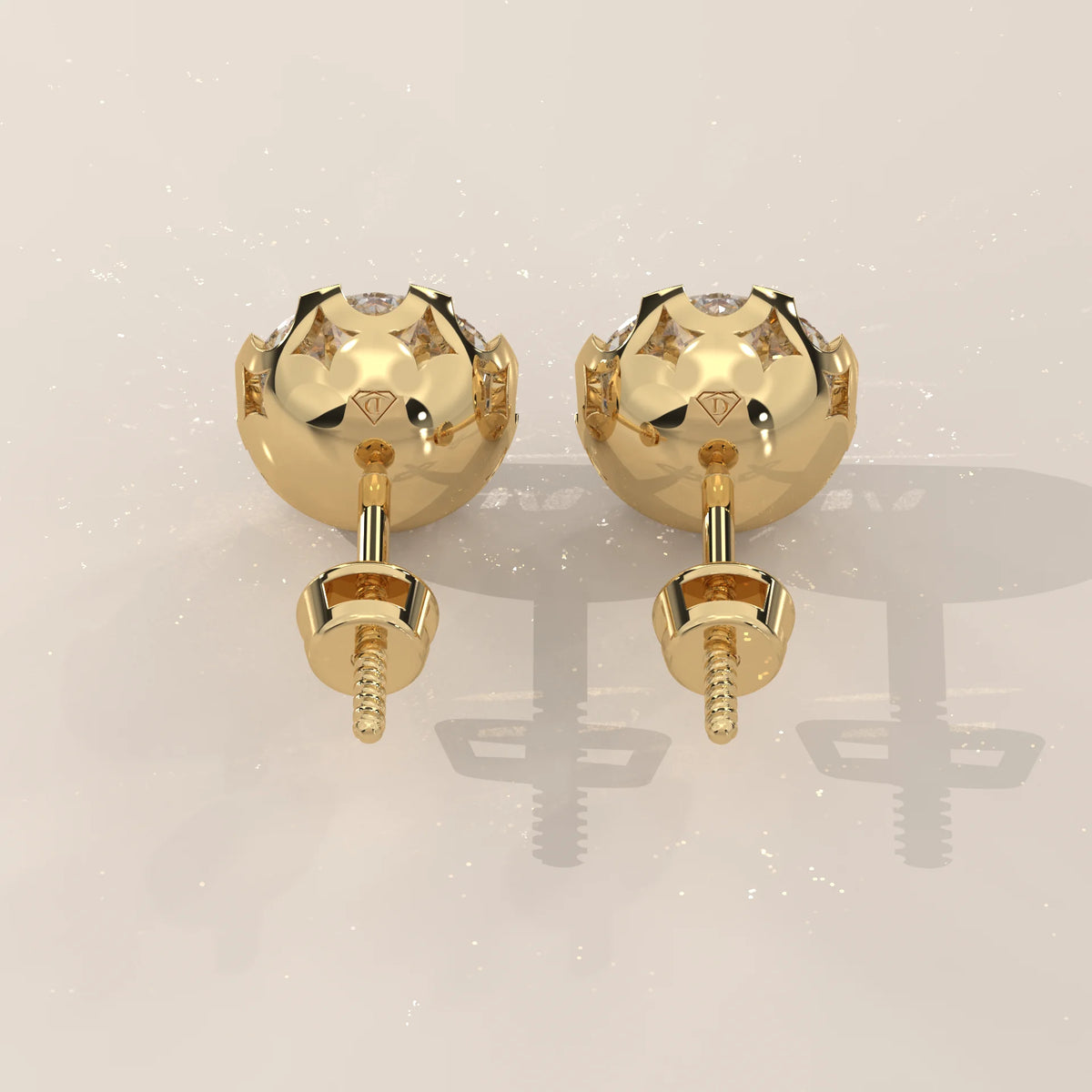 Round Solitaire Lab Grown Diamond Studs in a Crown Setting in yellow gold, shown on a plain background.
