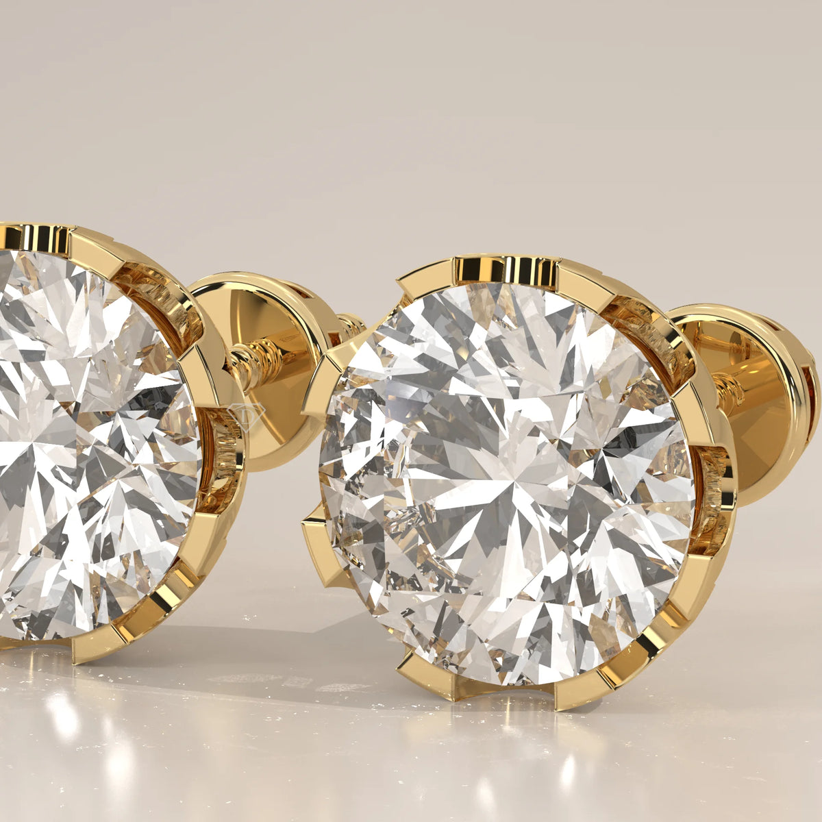 Round Solitaire Lab Grown Diamond Studs in a Crown Setting in yellow gold, photographed head-on.