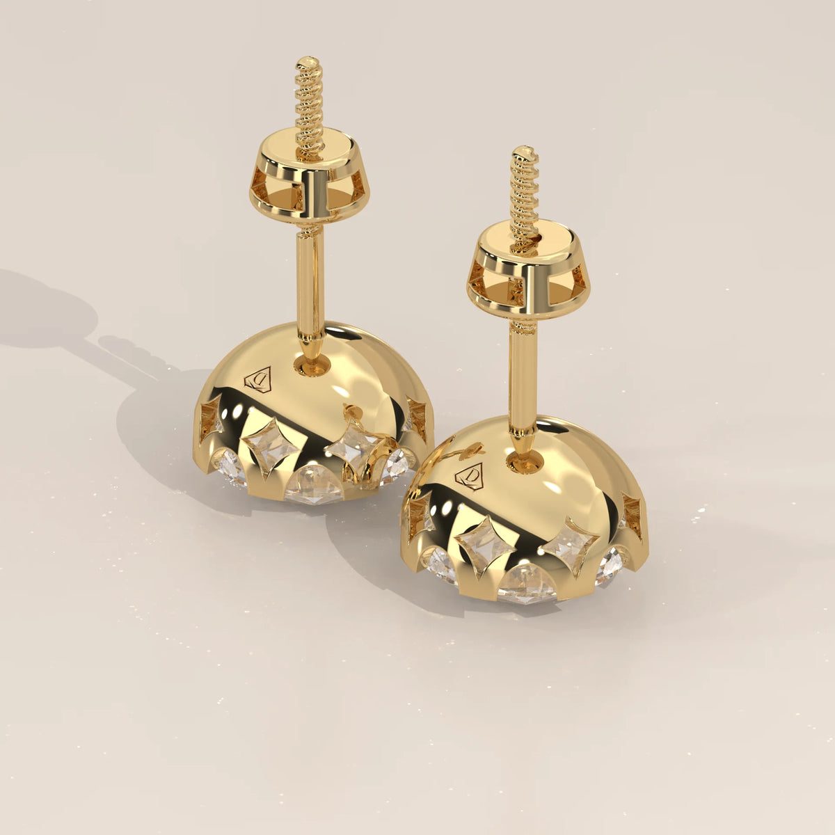 Round Solitaire Lab Grown Diamond Studs in a Crown Setting in yellow gold, front view on a plain background.