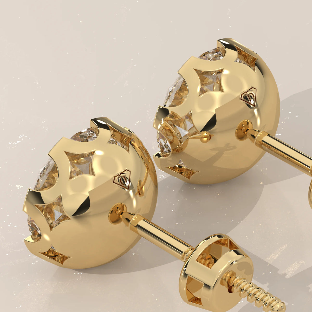 Round Solitaire Lab Grown Diamond Studs in a Crown Setting in yellow gold, shown from the side.