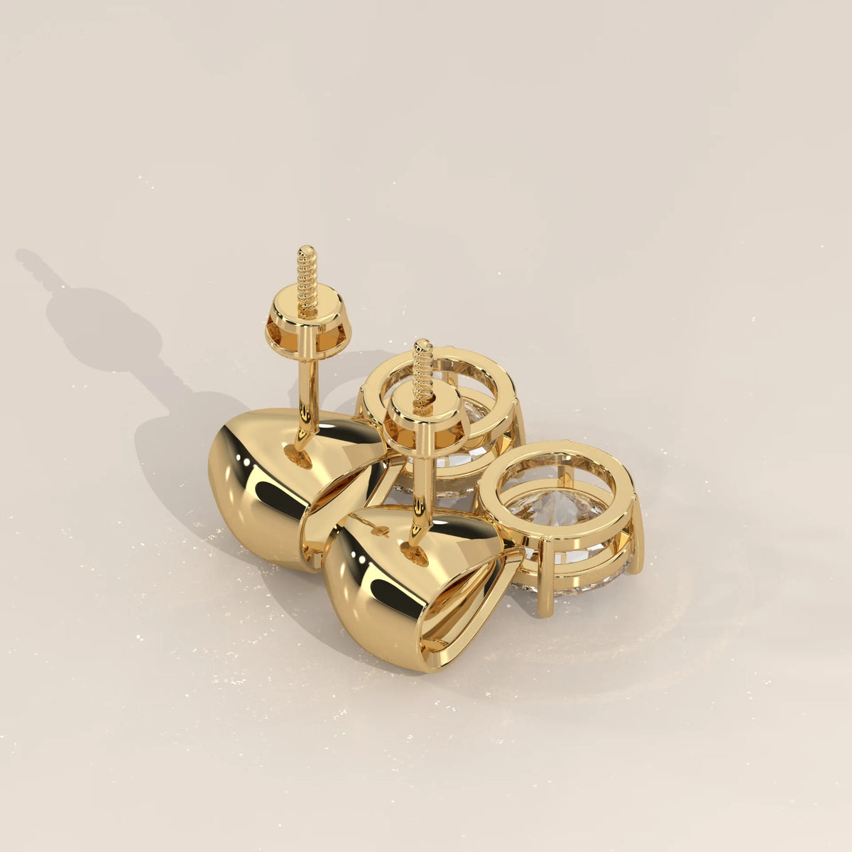 Round Solitaire Lab Grown Diamond Studs Under a Polished Gold Cap in yellow gold, product photograph on a plain background.